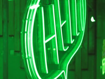 Abstract glowing green light in a dark room